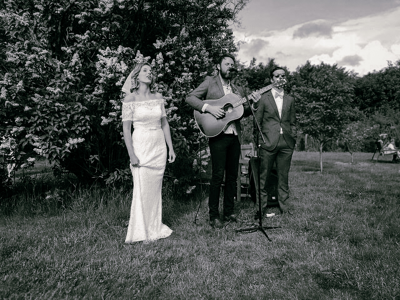 Jack performing live acoustic guitar at a wedding ceremony